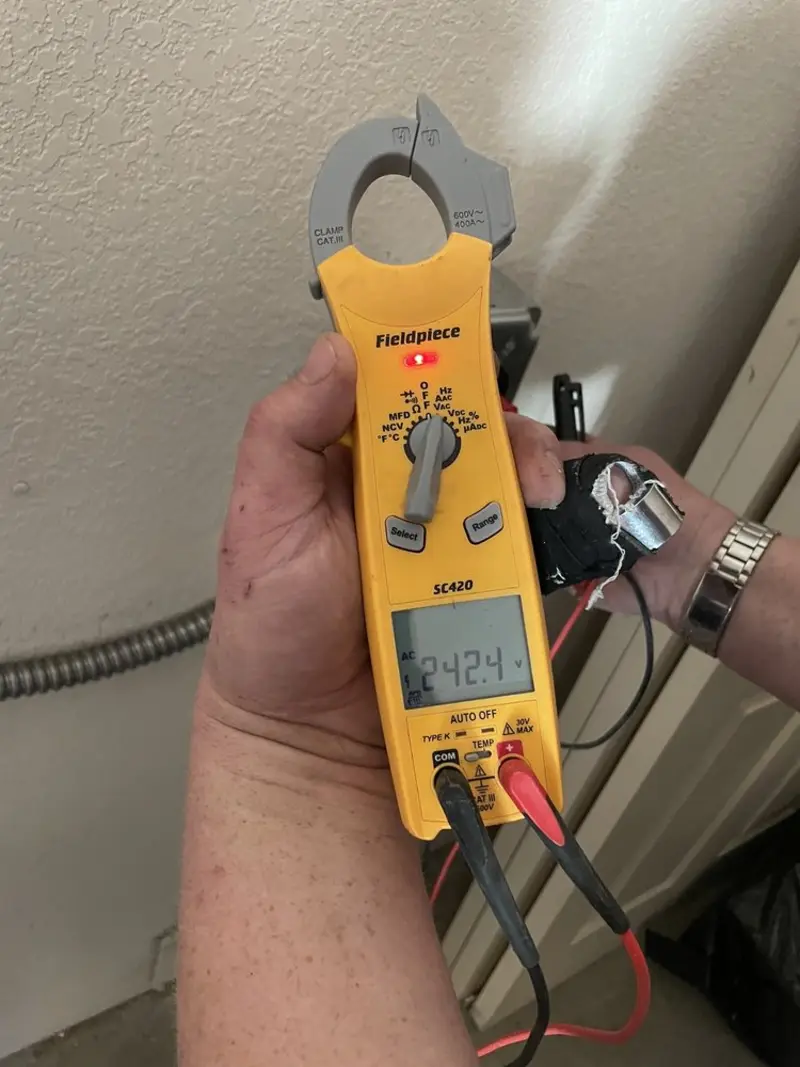 Voltage testing with clamp meter during Recessed Lighting Installation in Red Bank